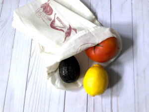 Image of produce bag with avocado, lemon and tomato. 3 Tips For Your First Zero-Waste Shopping Trip